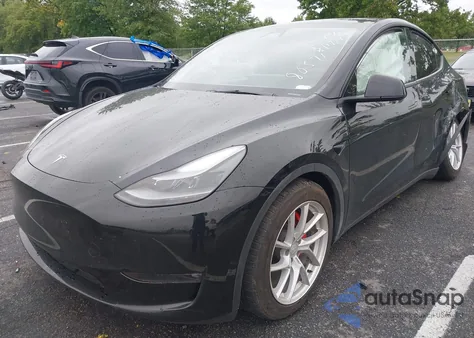 2023 Tesla Model Y Performance Dual Motor All-Wheel Drive z USA, uszkodzony, nr VIN 7SAYGDEF7PF980571